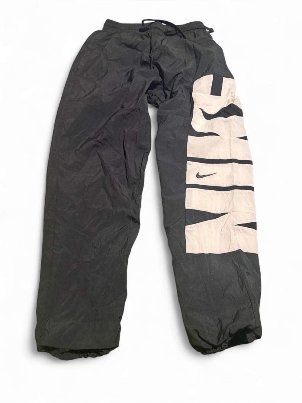 Nike black windbreaker nylon pants with white Nike logo and swoosh, size S